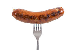 A sausage on a fork
