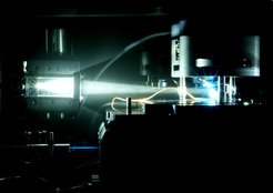 Figure 2: Photograph of the SFM in the glove box. An upright standing sample is illuminated with white light.in the photosensitive scanning probe microscope, two types of sample illumination are available: white light (top) and laser light at 488 nm (bottom).